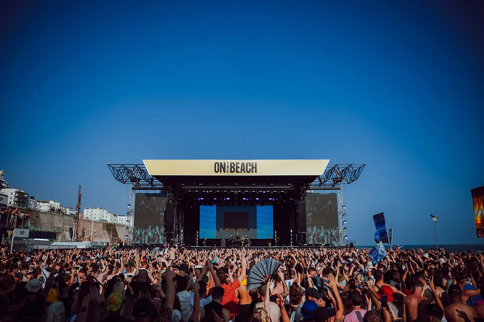 Sun setting over the On The Beach festival stage