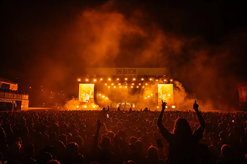 Confetti falling over the beach festival audience